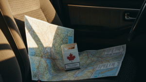 Canadian cigarettes with maple leaf symbol on road maps illustrating cross-province shopping for discount tobacco prices