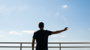 Man standing outdoors with good ventilation to minimize cigarette smell attachment to clothing and body
