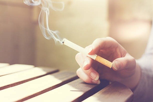 Adult smoker using a filter tip cigarette